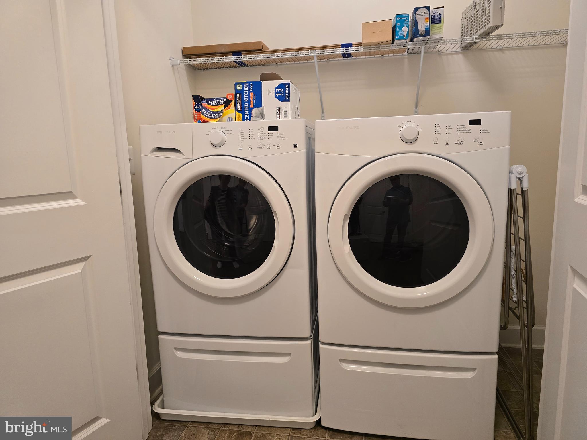 10530 Resort Road, Unit 101 Ellicott City, MD 21042 - Photo 6 of 13 a utility room with dryer and washer