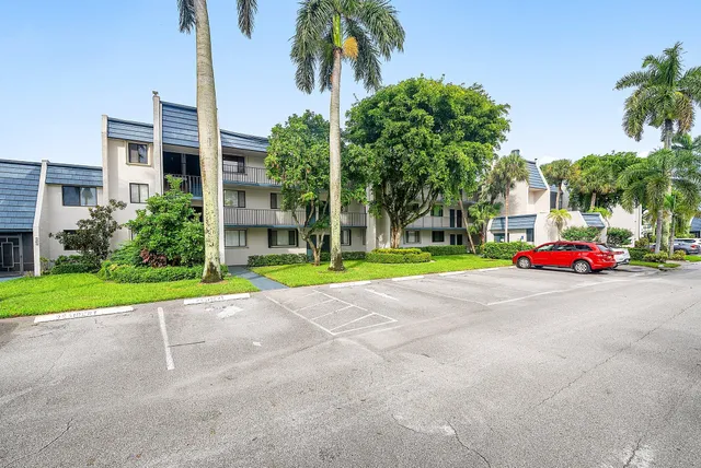 a view of a parked cars in front of a building