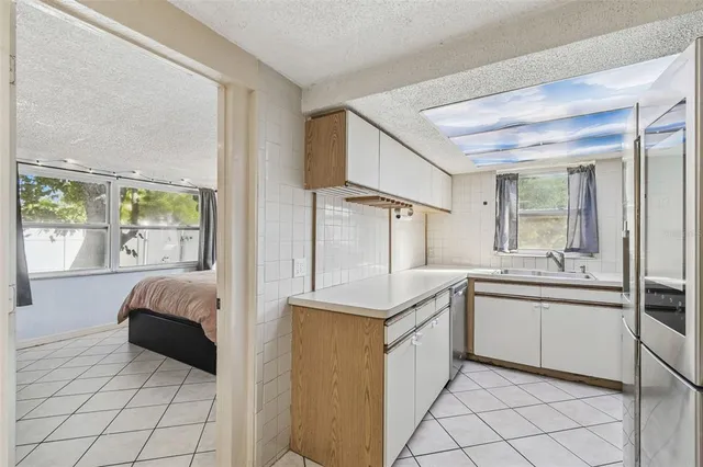 a view of a hallway with a rooms