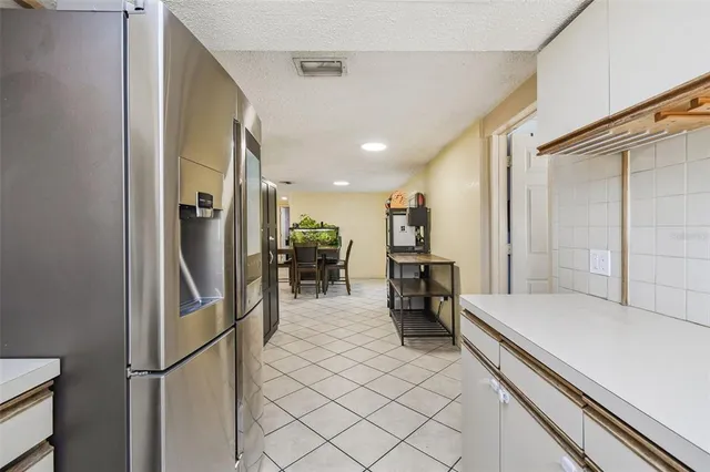 a bedroom with a bed mirror and window