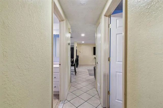 a bedroom with a large bed and flat tv screen