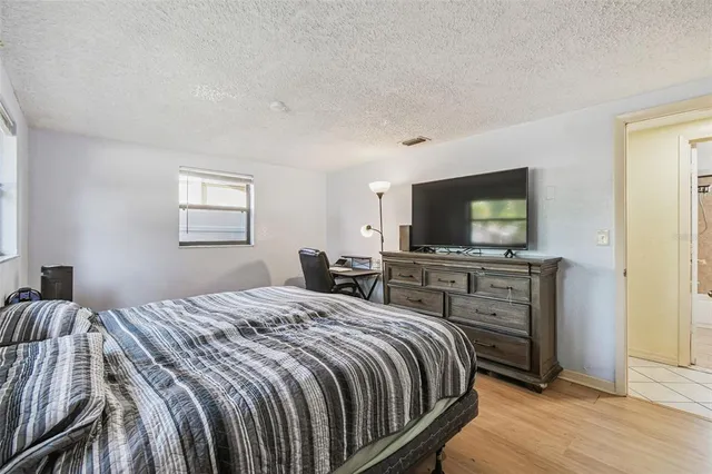 a view of an outdoor dining space with a table and chair