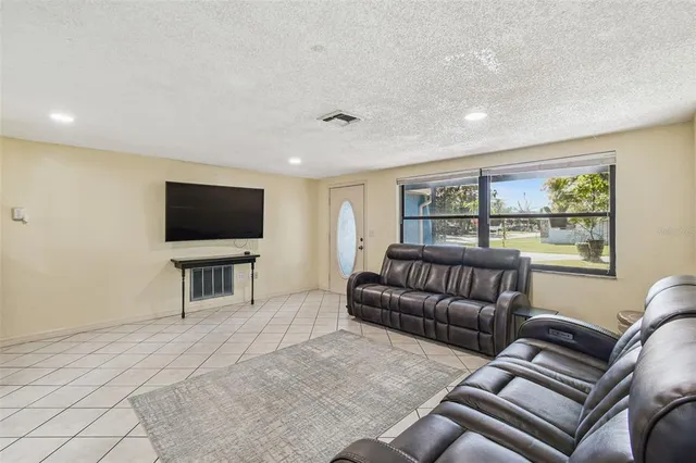 a living room with furniture and a couch