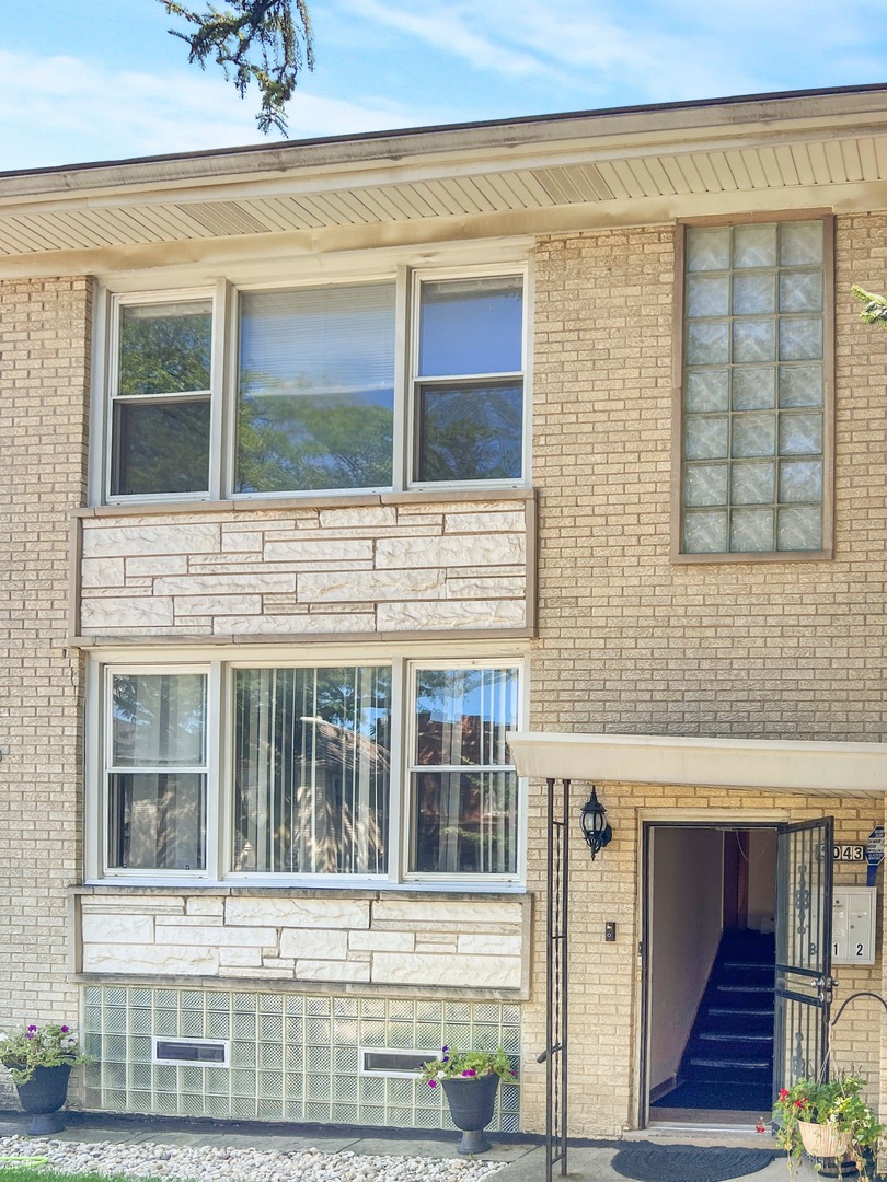 a view of brick building with a window
