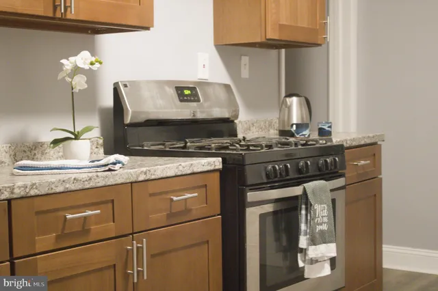 a kitchen with a stove and cabinets