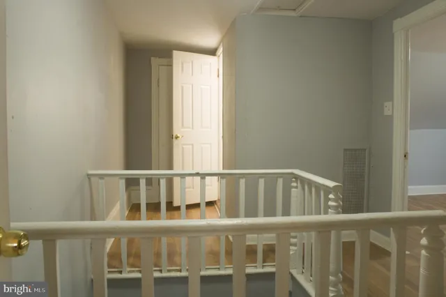 a white toilet sitting next to a sink