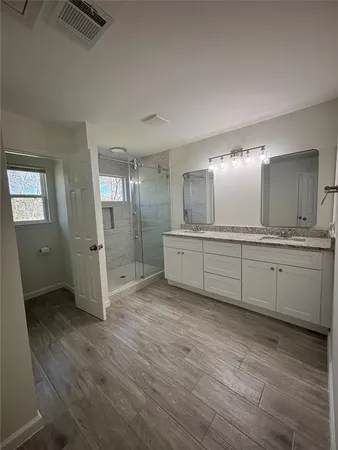 a view of a kitchen counter space and wooden floor