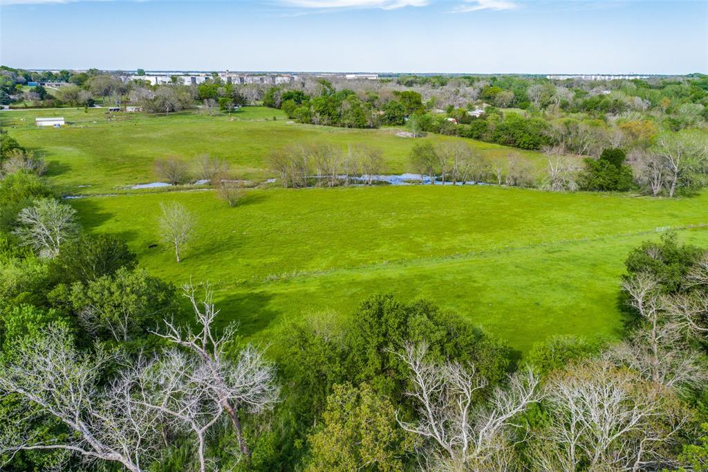 1230 Old Mill Road McKinney, TX 75069 - Photo 3 of 6 a view of a green field with lawn chairs and large trees