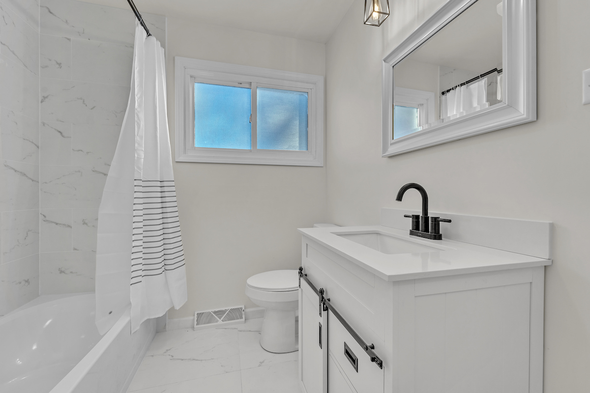 3320 Stonegate Road Waukegan, IL 60087 - Photo 10 of 21 a bathroom with a sink a toilet and shower