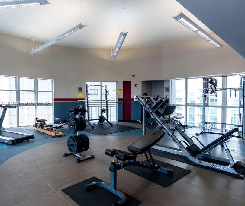 7275 Southwest 90th Way, Unit 404 Miami, FL 33156 - Photo 27 of 35 a view of a room with gym equipment