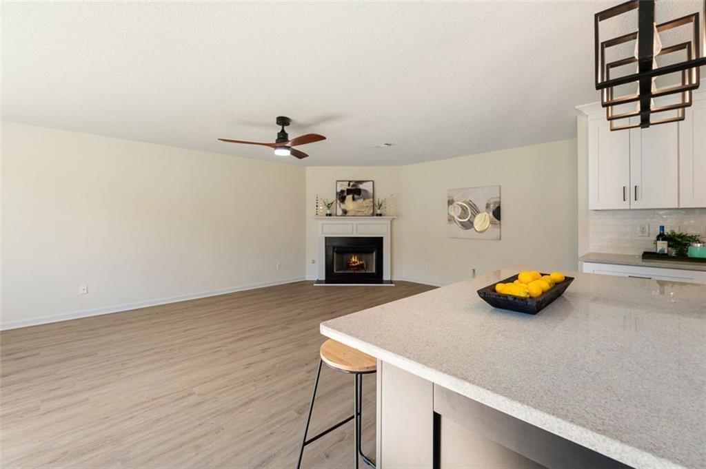 191 Kyndal Drive Hampton, GA 30228 - Photo 16 of 49 a view of a kitchen with furniture and a ceiling fan