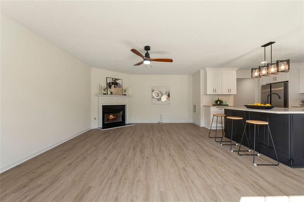 191 Kyndal Drive Hampton, GA 30228 - Photo 17 of 49 a living room with furniture and a fireplace