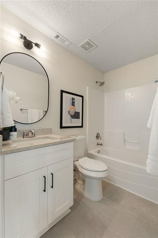 191 Kyndal Drive Hampton, GA 30228 - Photo 23 of 49 a bathroom with a toilet a sink a mirror and a bathtub