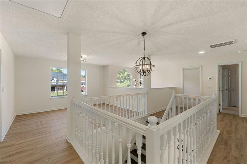 191 Kyndal Drive Hampton, GA 30228 - Photo 25 of 49 a view of entryway and hall with wooden floor