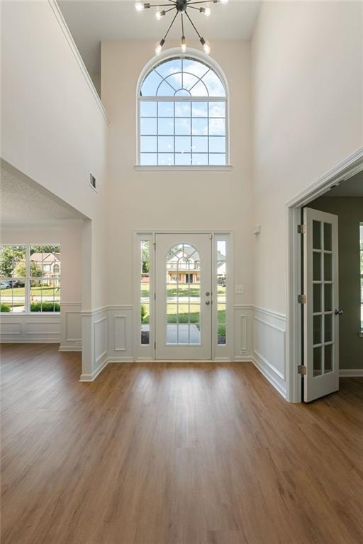 191 Kyndal Drive Hampton, GA 30228 - Photo 3 of 49 wooden floor in an empty room with a window