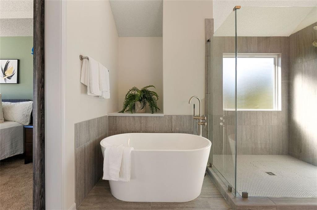 191 Kyndal Drive Hampton, GA 30228 - Photo 34 of 49 a bathroom with a bathtub and shower