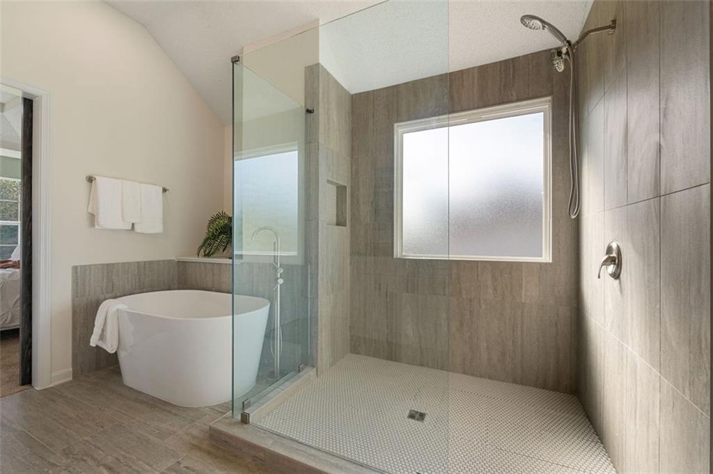 191 Kyndal Drive Hampton, GA 30228 - Photo 35 of 49 a bathroom with a bathtub and shower