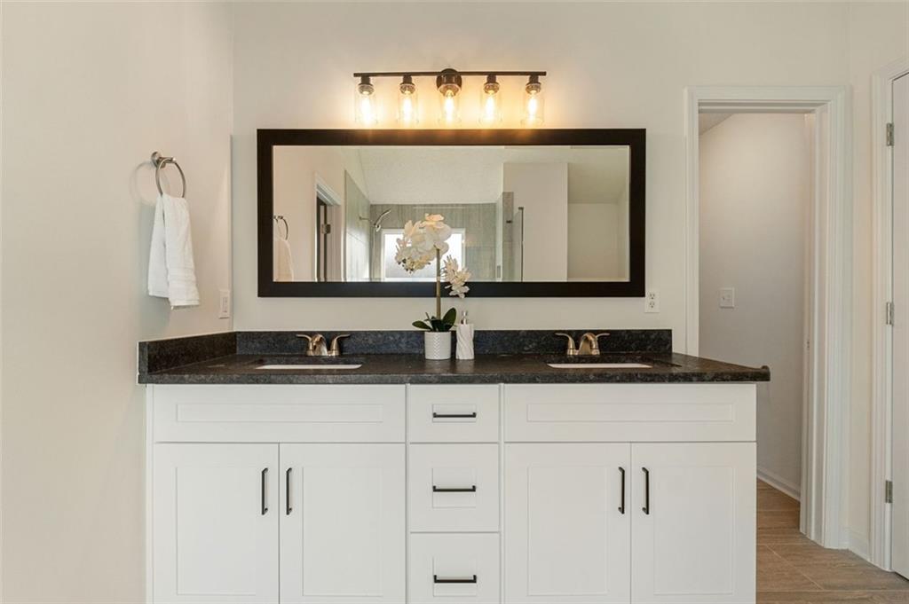 191 Kyndal Drive Hampton, GA 30228 - Photo 36 of 49 a bathroom with a sink and a mirror