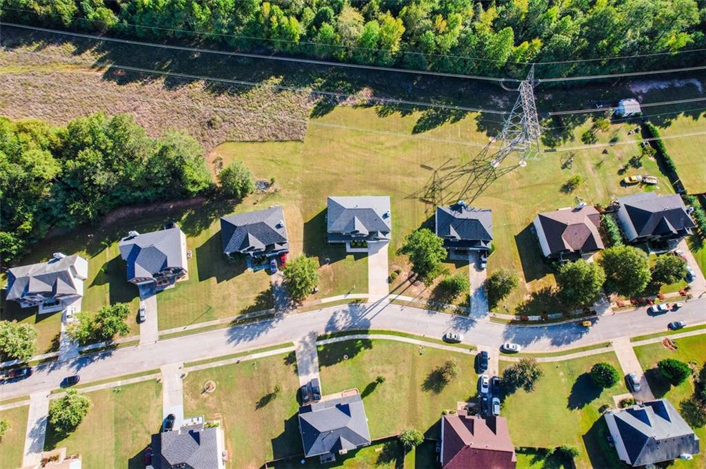 191 Kyndal Drive Hampton, GA 30228 - Photo 47 of 49 an aerial view of swimming pool with outdoor seating and trees