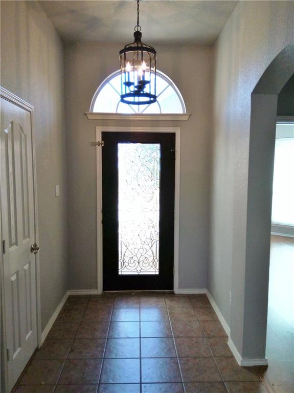a view of entryway with chandelier
