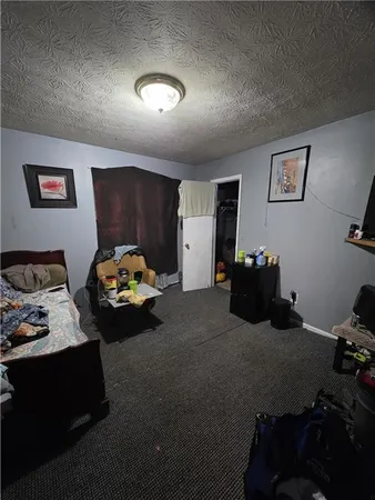 a bed room with furniture and a window