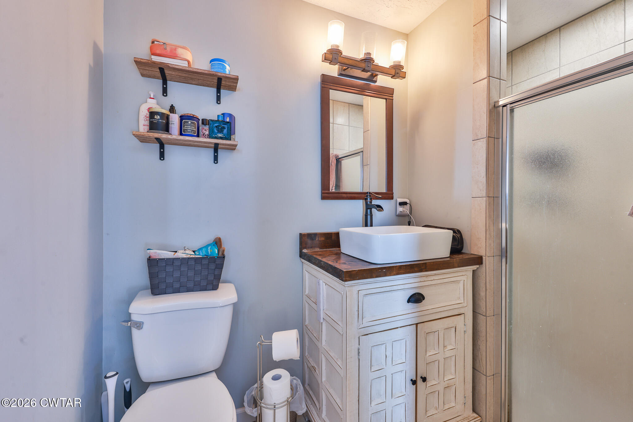 125 Old Dyer-Trenton Road Dyer, TN 38330 - Photo 11 of 40 a bathroom with a toilet a sink and mirror