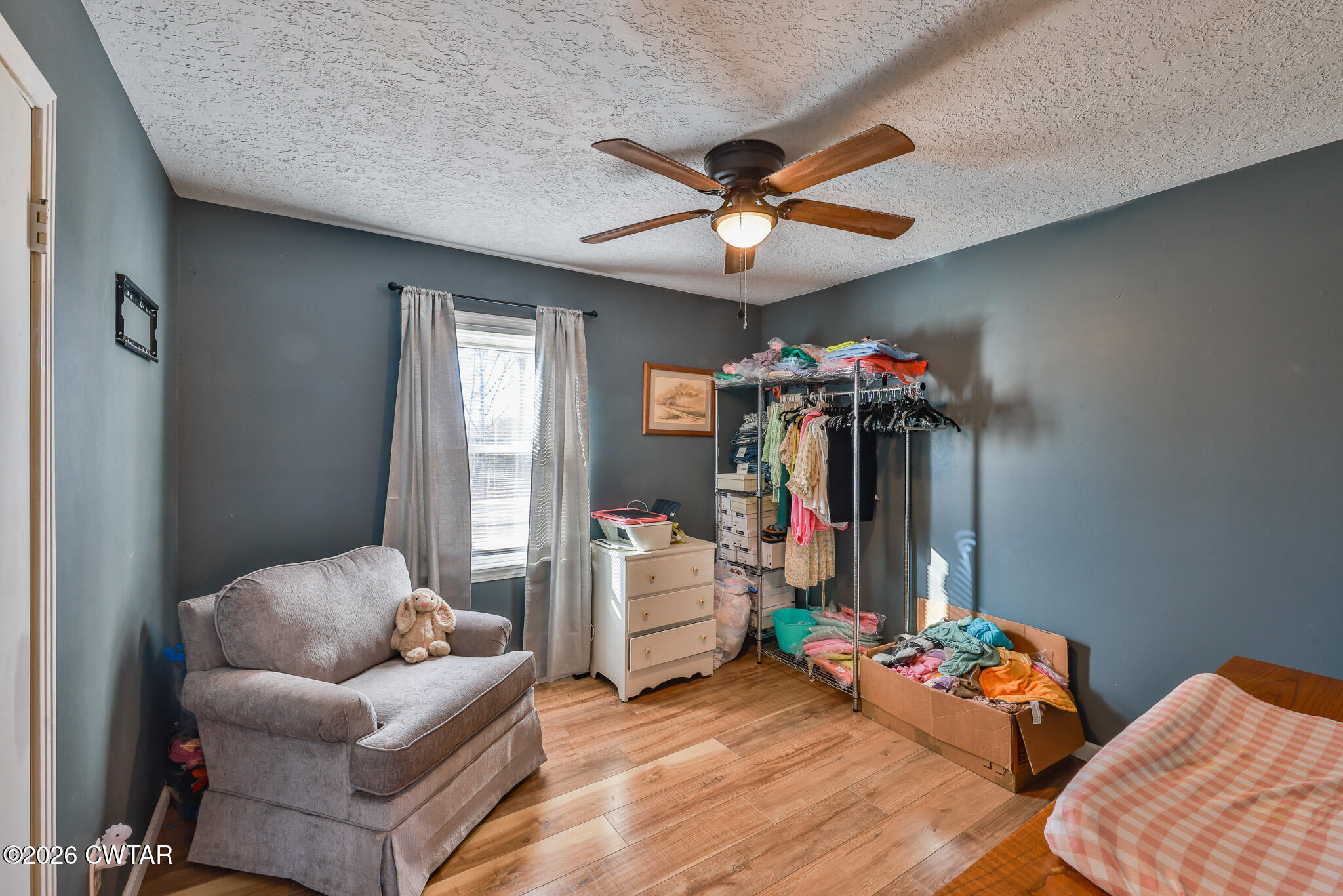 125 Old Dyer-Trenton Road Dyer, TN 38330 - Photo 12 of 40 a living room with furniture and a chandelier