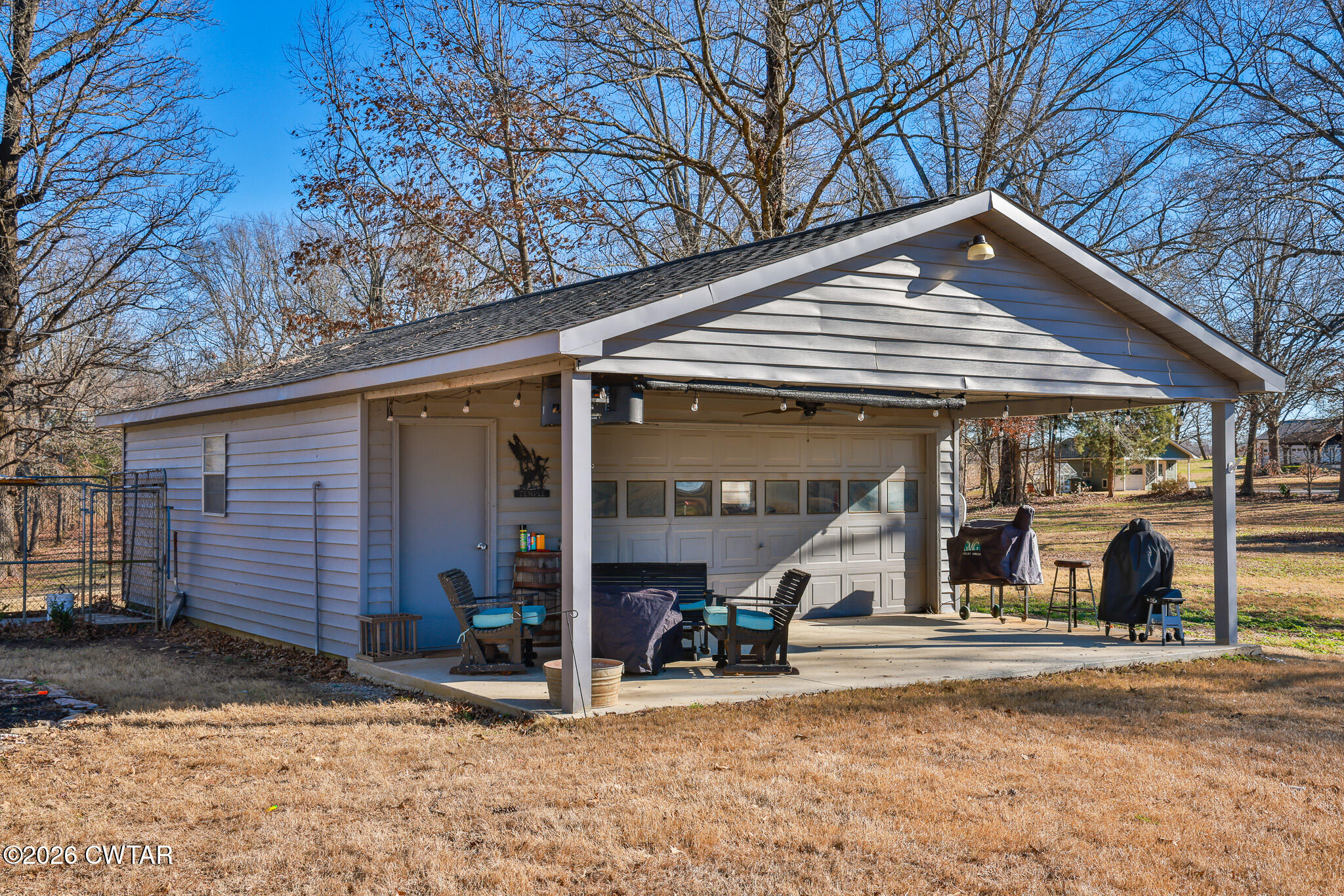 125 Old Dyer-Trenton Road Dyer, TN 38330 - Photo 15 of 40 a view of a house with a patio and a yard