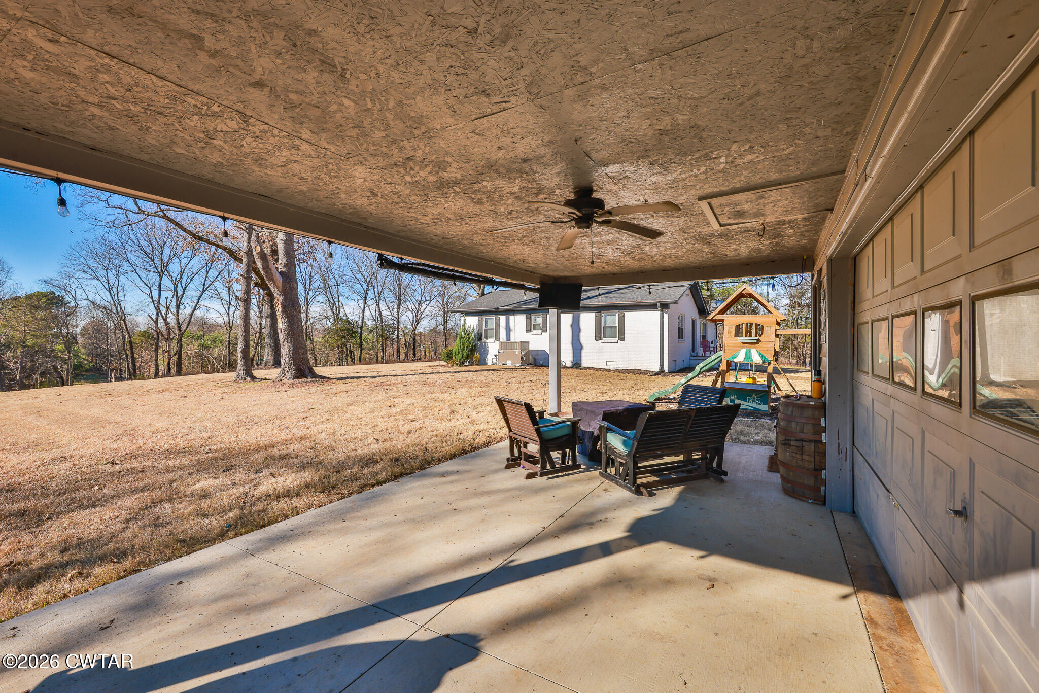 125 Old Dyer-Trenton Road Dyer, TN 38330 - Photo 20 of 40 a view of a patio with a table and chairs