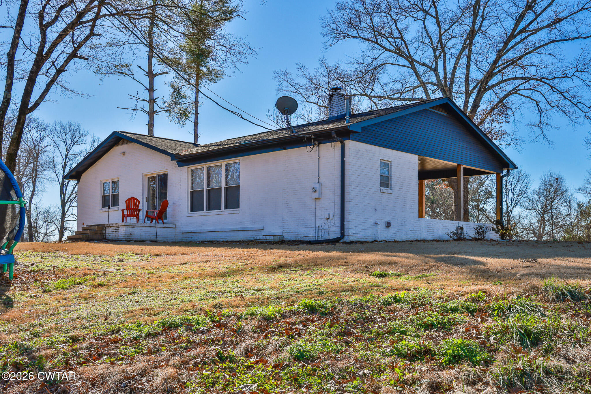 125 Old Dyer-Trenton Road Dyer, TN 38330 - Photo 23 of 40 a view of a house with backyard and trees