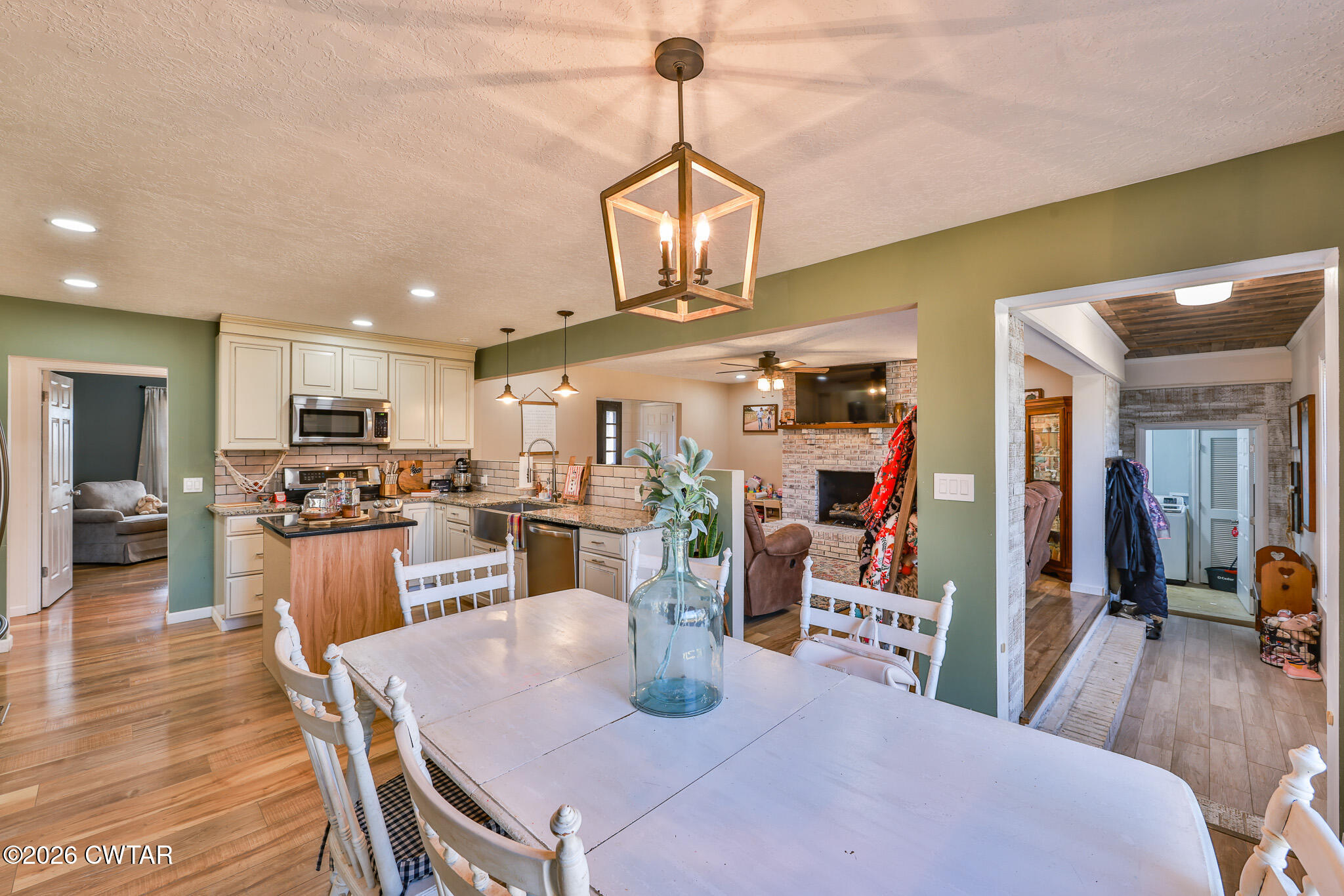 125 Old Dyer-Trenton Road Dyer, TN 38330 - Photo 5 of 40 a view of a dining room with furniture wooden floor and chandelier