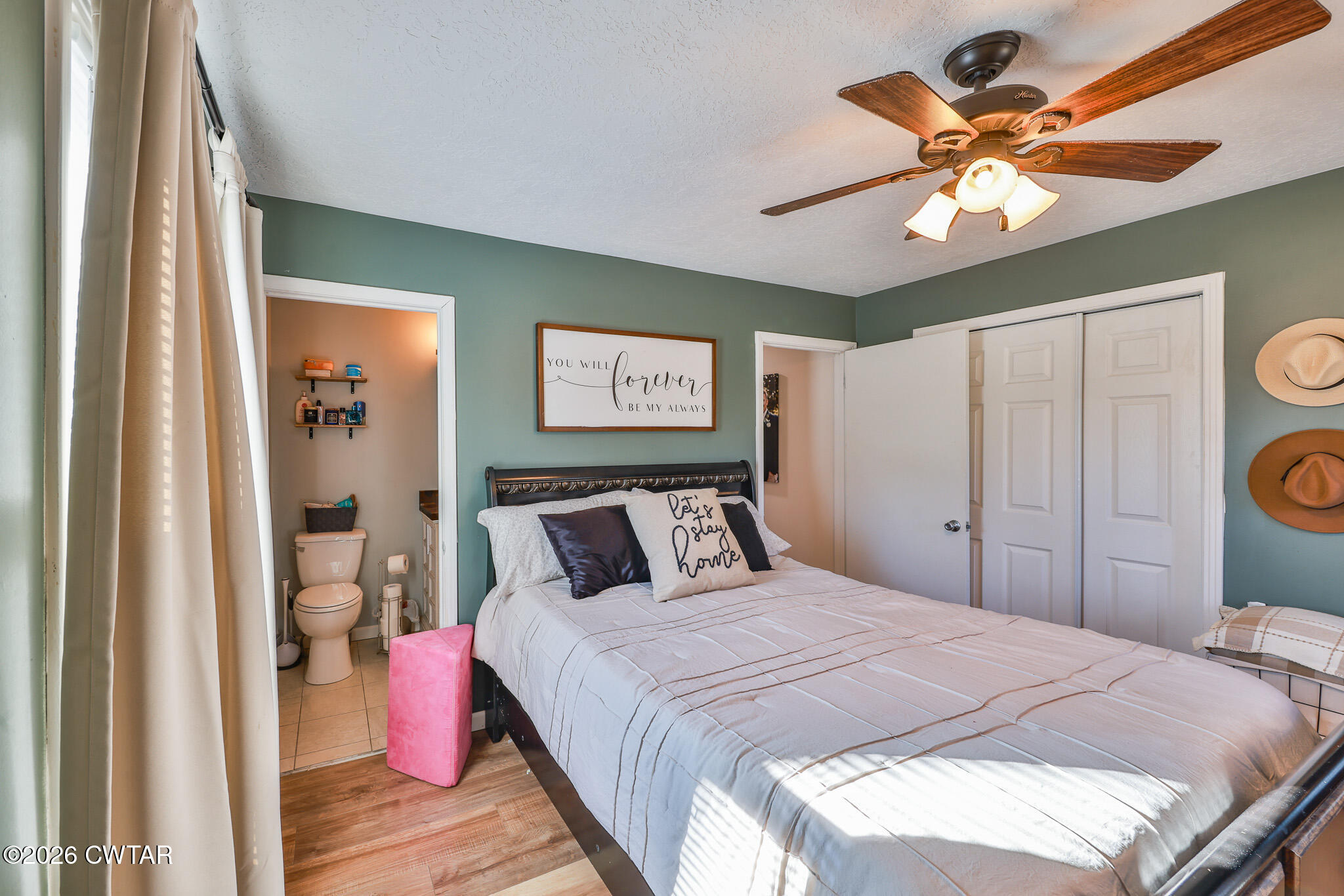 125 Old Dyer-Trenton Road Dyer, TN 38330 - Photo 10 of 40 a bedroom with a bed and a chandelier