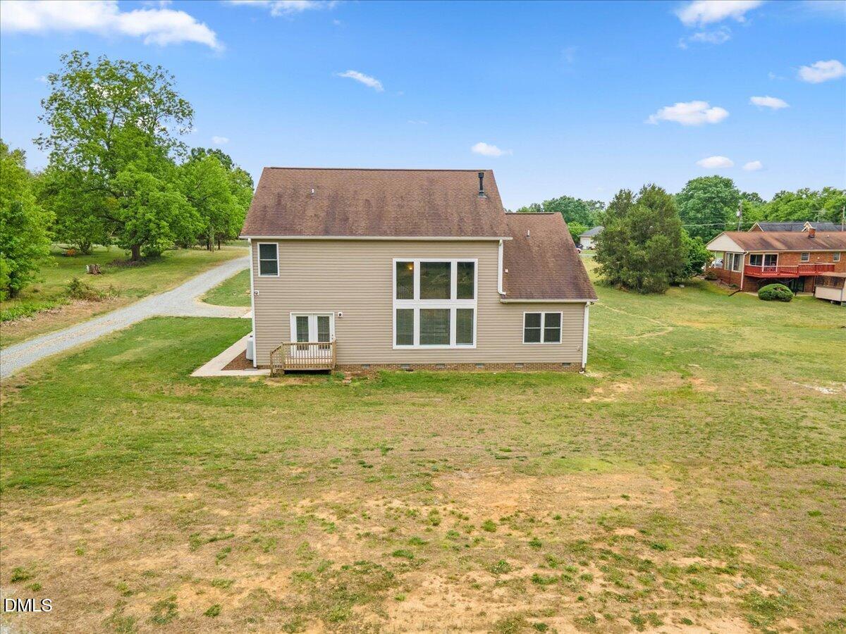 704 Haw River Hopedale Road Burlington, NC 27217 - Photo 37 of 49 a view of a house with a yard