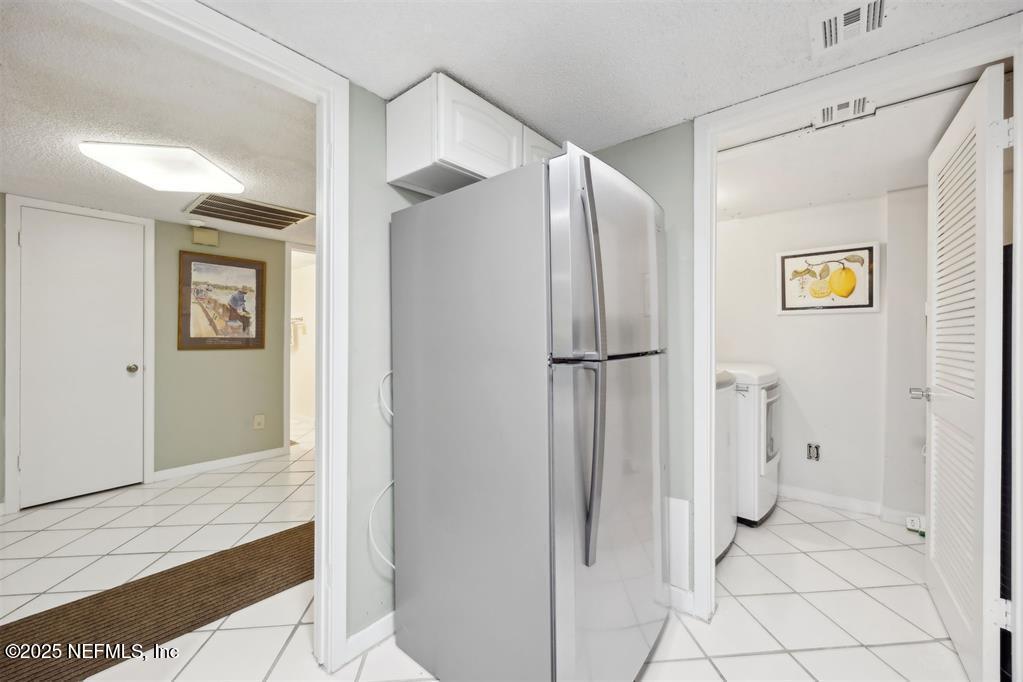 2021 Beachwood Road Fernandina Beach, FL 32034 - Photo 12 of 32 a bathroom with a glass shower door and a sink