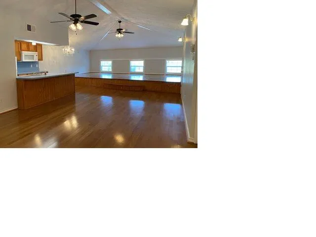 a black and white photo of a living room