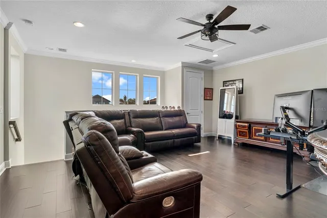 a kitchen with a table chairs and a wooden floor