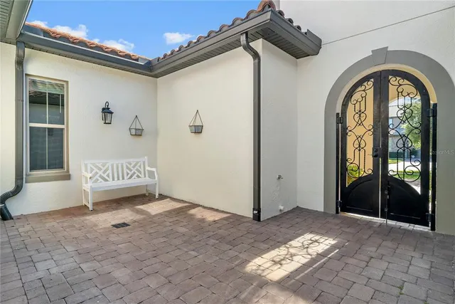 a outdoor space with a table and chairs