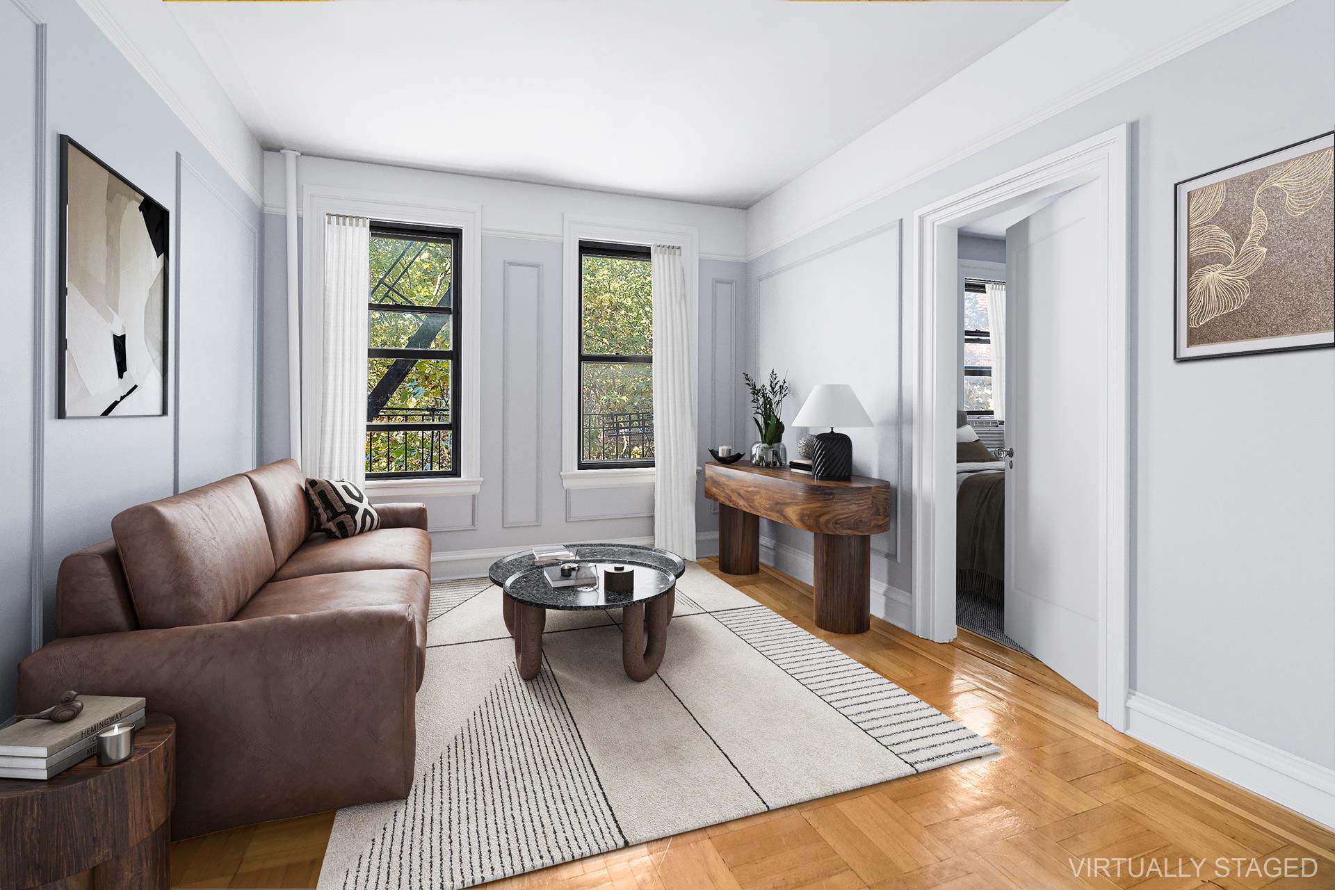 1-03 Minetta Street, Unit 5B Manhattan, NY 10012 - Photo 1 of 12 a living room with furniture rug and window