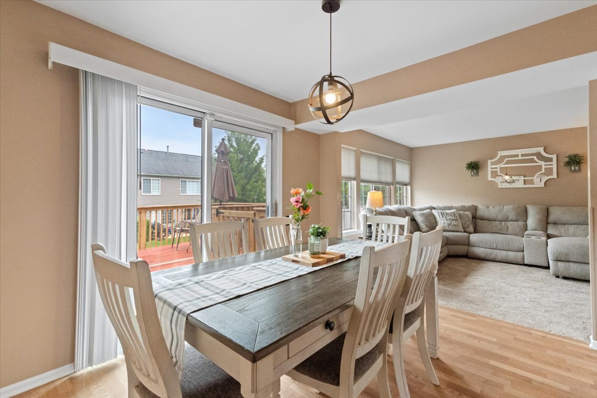 423 Spaulding Road Bartlett, IL 60103 - Photo 8 of 28 a view of a dining room with furniture wooden floor and chandelier