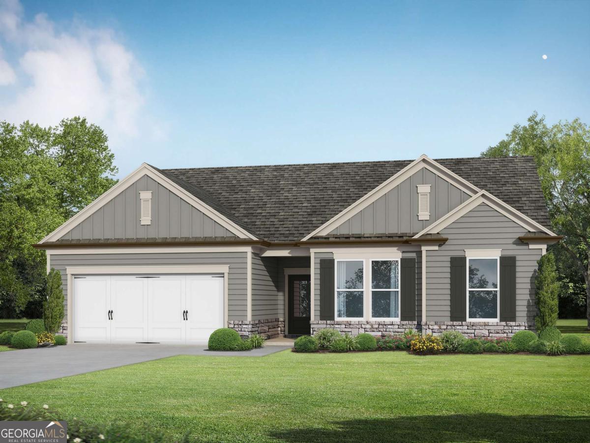 552 Lillian Way Statham, GA 30666 - Photo 1 of 1 a front view of a house with garden