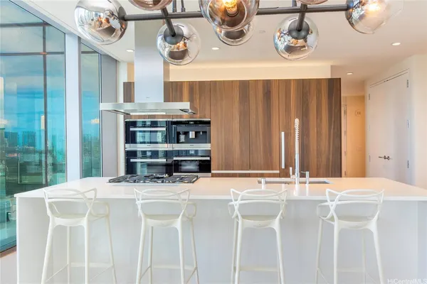 a kitchen with a table and chairs in it