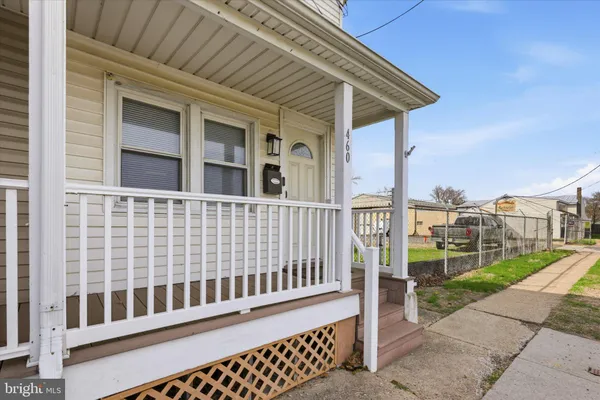 a porch with view of a house