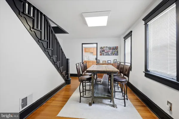 a view of a dining room with furniture and a window