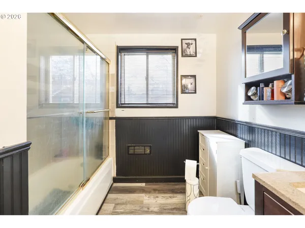 a bathroom with a bathtub and a window