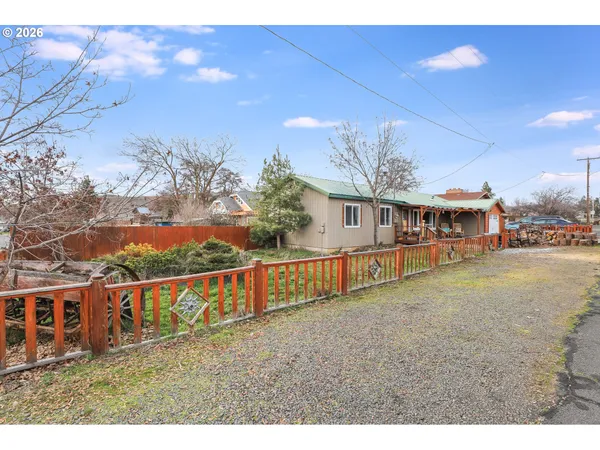 a view of a house with roof deck front of house