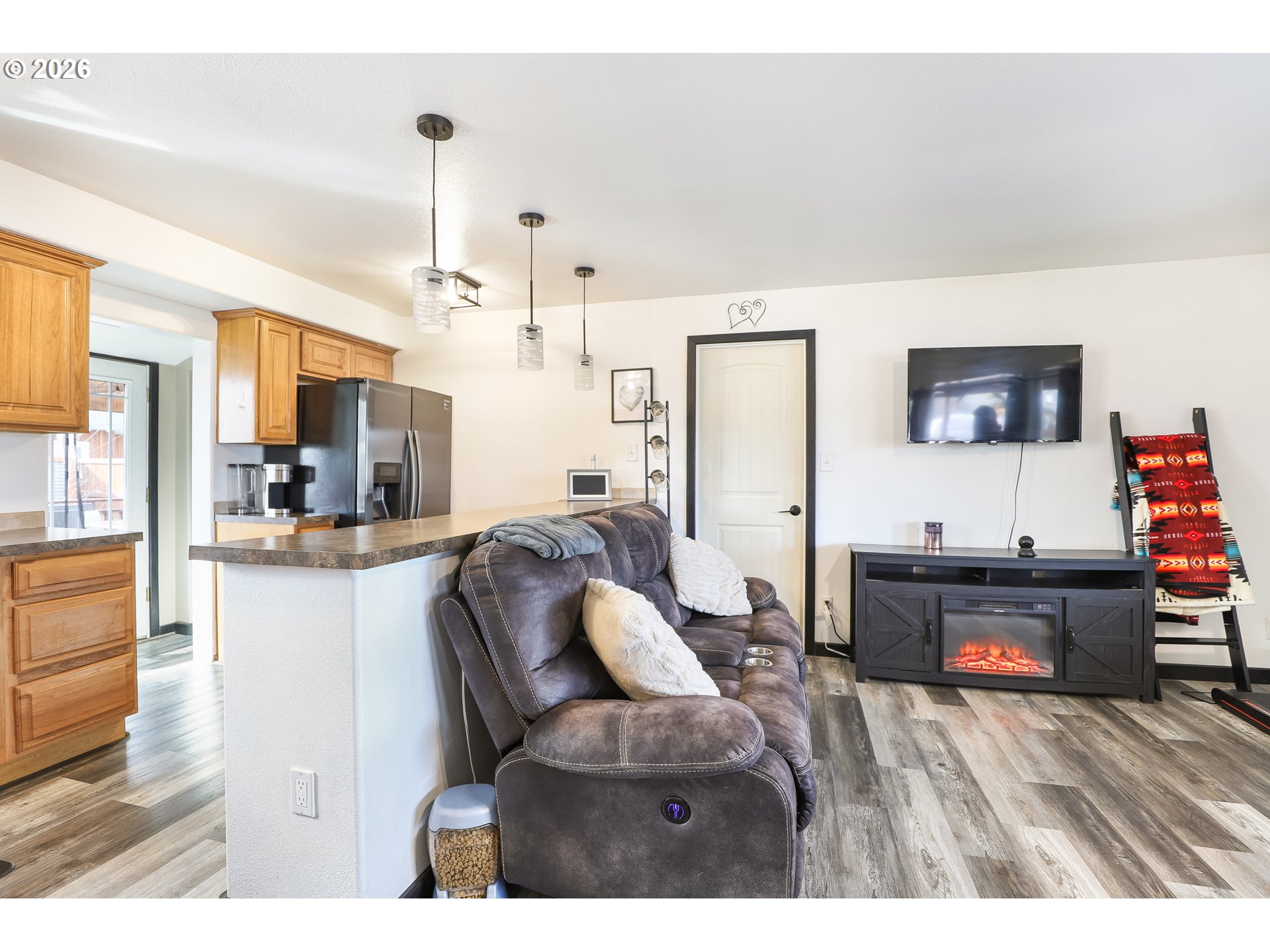 409 Northeast Court Street Dufur, OR 97021 - Photo 21 of 38 a living room with furniture and a flat screen tv