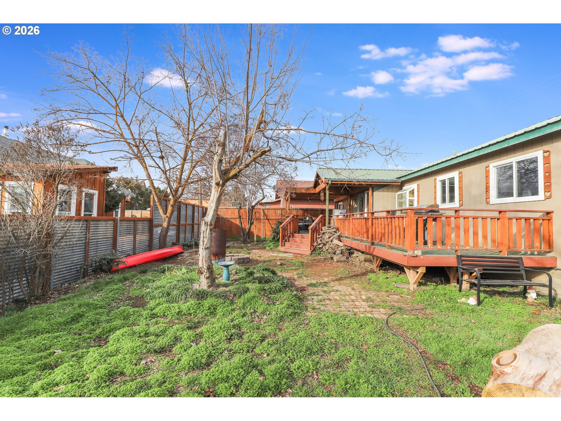409 Northeast Court Street Dufur, OR 97021 - Photo 30 of 38 a backyard of a house with table and chairs