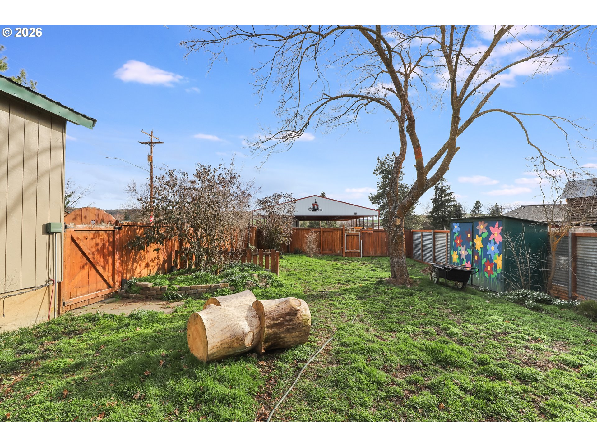 409 Northeast Court Street Dufur, OR 97021 - Photo 32 of 38 a view of a backyard with large tree