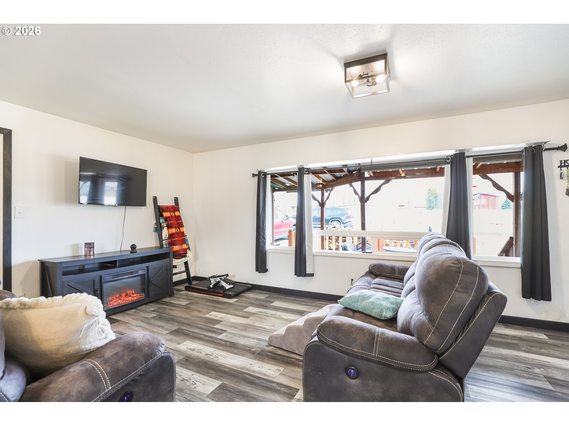 409 Northeast Court Street Dufur, OR 97021 - Photo 5 of 38 a living room with furniture window and a flat screen tv