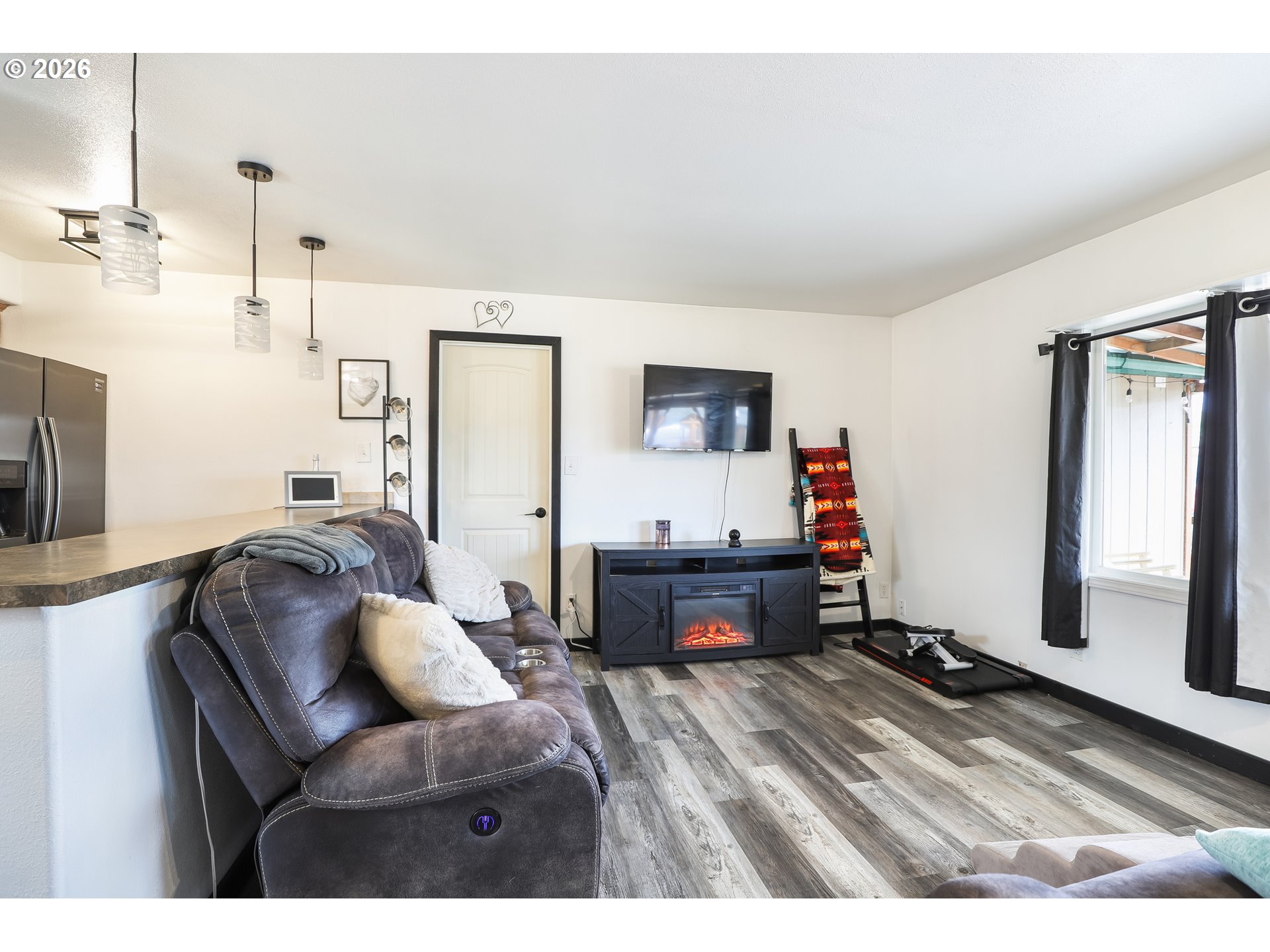 409 Northeast Court Street Dufur, OR 97021 - Photo 6 of 38 a living room with furniture and a flat screen tv